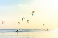 Kite-surfing and a lot of silhouettes of kites in the sky. Holidays on nature. Artistic picture. Beauty world. Royalty Free Stock Photo
