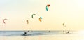 Kite-surfing and a lot of silhouettes of kites in the sky. Holidays on nature. Artistic picture. Beauty world. Panorama Royalty Free Stock Photo