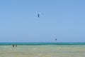 Kite surfing man jumping in sky. Recreational activity, water sports, action, hobby and fun in summer time. Kiteboarding sport