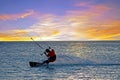 Kite surfing at Palm Beach on Aruba in the Caribbean Sea at sunset Royalty Free Stock Photo