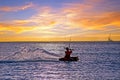 Kite surfing at Palm Beach on Aruba in the Caribbean Sea at sunset Royalty Free Stock Photo