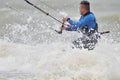 Kite surfing in spray.