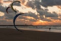 Kite surfing in the sunset at Dutch beach Royalty Free Stock Photo