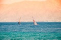 .Kite Surfing and Windsurfing in Eilat. Azure sea against the background of mountains, Khamsin in Israel Royalty Free Stock Photo