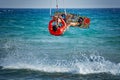 Kiteboarder, kitesurfer performing kiteboarding kitesurfing tricks on the water Royalty Free Stock Photo