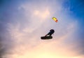 Kiteboarder performing a jump against sky