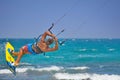 Kiteboarder performing kiteboarding jumps and tricks