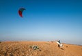 Kiteboarder pulling tricks and getting air on a bright summers day with perfect clear blue sky`s. Shingle Strret, Suffolk, UK