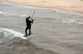 Kiteboarder sails onto the beach