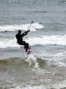 Kiteboarder skims the waves