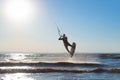 Kiteboarder surfing waves with kiteboard on a sunny summer day Royalty Free Stock Photo