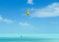 A kiteboarder surfs in the Caribbean Sea in the Turks and Caicos islands