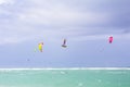 Kiteboarding. Fun in the ocean. Extreme Sport Kitesurfing. Kitesurfer jumping high in the air performing triks during Royalty Free Stock Photo