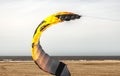 Kiteboarding kite spark lying on the beach