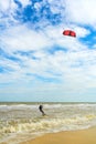 Kiteboarding. A kite surfer rides the waves. Holidays on nature.