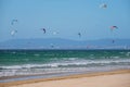 Kiteboarding kitesurfing kiteboarder kitesurfer kites on the ocean beach