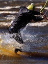 Kiteboarding trick with spray Royalty Free Stock Photo