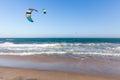 Kiters ride on the waves at Mui Ne beach,