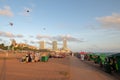 Kites flying at sunset at the Galle Face beachfront urban park area in Colombo Sri Lanka