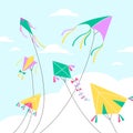 Kites in sky. Different shapes air toys on clouds backdrop, blue sky background, colorful holiday Basant Panchami