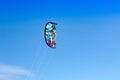 The kitesurf closeup over on the bright blue sky