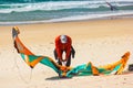 Kitesurfer blowing its kite with an air bomb before training Royalty Free Stock Photo