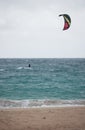 A kitesurfer in the distance off the coast of Uoleva in Tonga Royalty Free Stock Photo