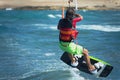 Kitesurfer flying over the wave Royalty Free Stock Photo