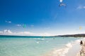 A kitesurfer gliding near the beach La Cinta, Sardinia Royalty Free Stock Photo