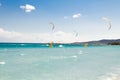 A kitesurfer gliding near the beach La Cinta, Sardinia Royalty Free Stock Photo
