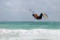 Kitesurfer jumping wave