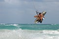 Kitesurfer jumping waves