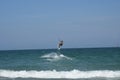 Kitesurfer leaping over waves off Wrightsville Beach Royalty Free Stock Photo