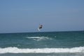 Kitesurfer leaping over waves off Wrightsville Beach Royalty Free Stock Photo