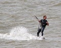 Kitesurfer one handed stunts