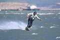 Kitesurfer riding his board toeside