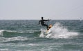 Kitesurfer with a sail boat