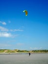 Kitesurfer walking back to the beach at Pointe aux oies, France