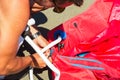 Kitesurfers on the beach prepare sport equipment for riding