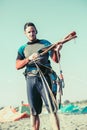 Kitesurfers on the beach prepare sport equipment Royalty Free Stock Photo