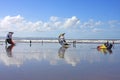 Kitesurfers on a beach