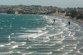 Kitesurfers in Omaha Bay in New Zealand