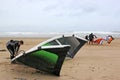 Kitesurfers preparing kites