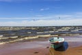 Kitesurfers on the shore of the Gulf of Finland on a windy summer day. Active sports in the vicinity of St. Petersburg