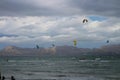 Kitesurfers on the waves on the beach of Playa de Alcudia . Alcudia.Majorca. Spain Royalty Free Stock Photo