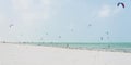 Kitesurfers on white sandy beach at Paje, Zanzibar