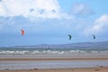 Kitesurfers and windsurfers riding at Troon, Scotland Royalty Free Stock Photo