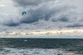 Kitesurfing athlete riding waves in a storm Royalty Free Stock Photo