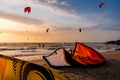 Kitesurfing beach, kiteboarding sport, kites n the beach and in the air at sunset, golden our landscape of Kite location, February