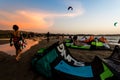 Kitesurfing beach, kiteboarding sport, kites n the beach and in the air at sunset, golden our landscape of Kite location, February